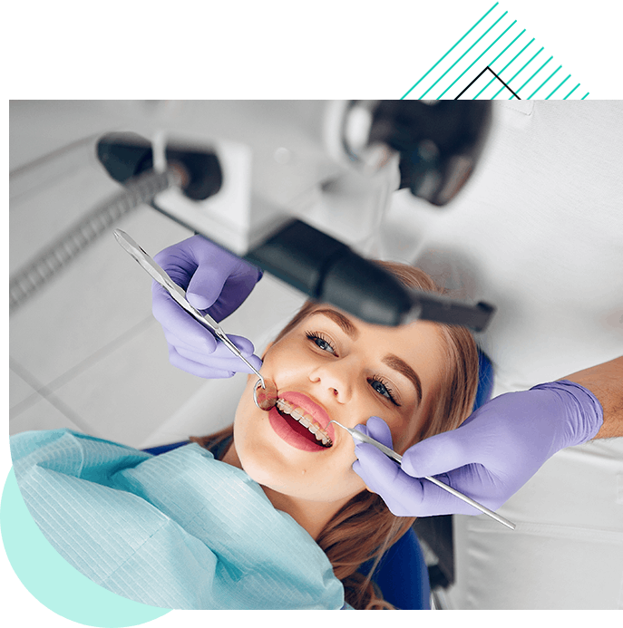 dentist-examining-female-patient-with-tools copy 2