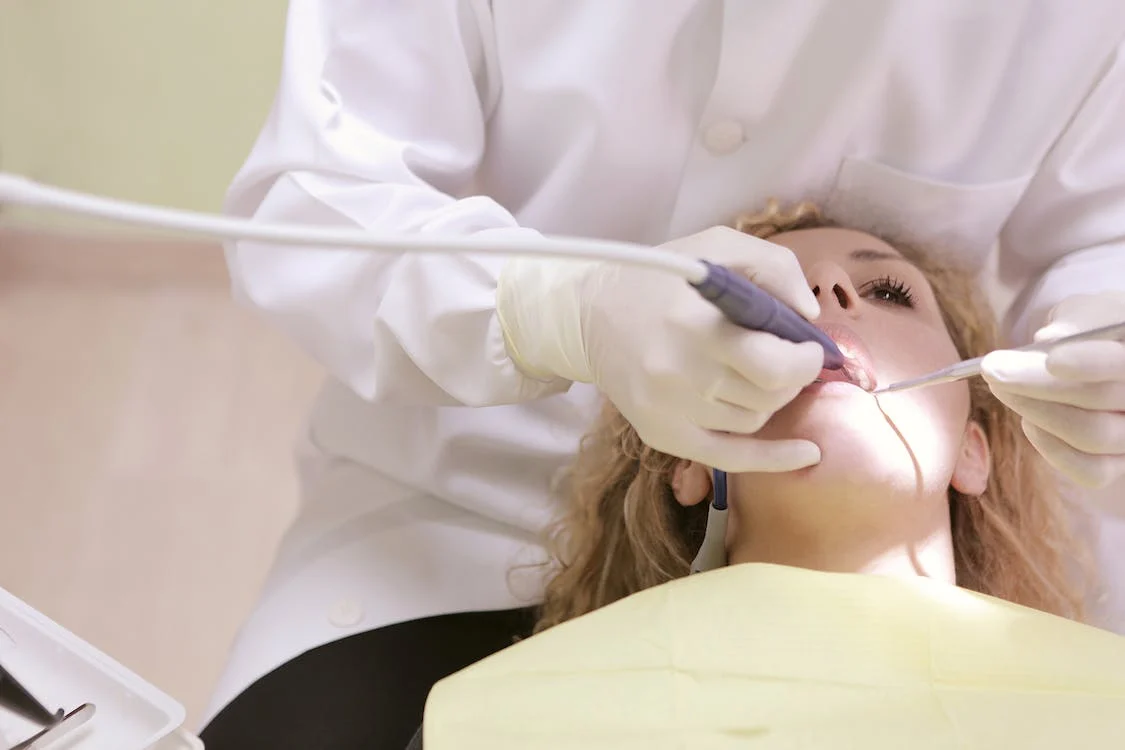 An image of a patient getting treated by dentist